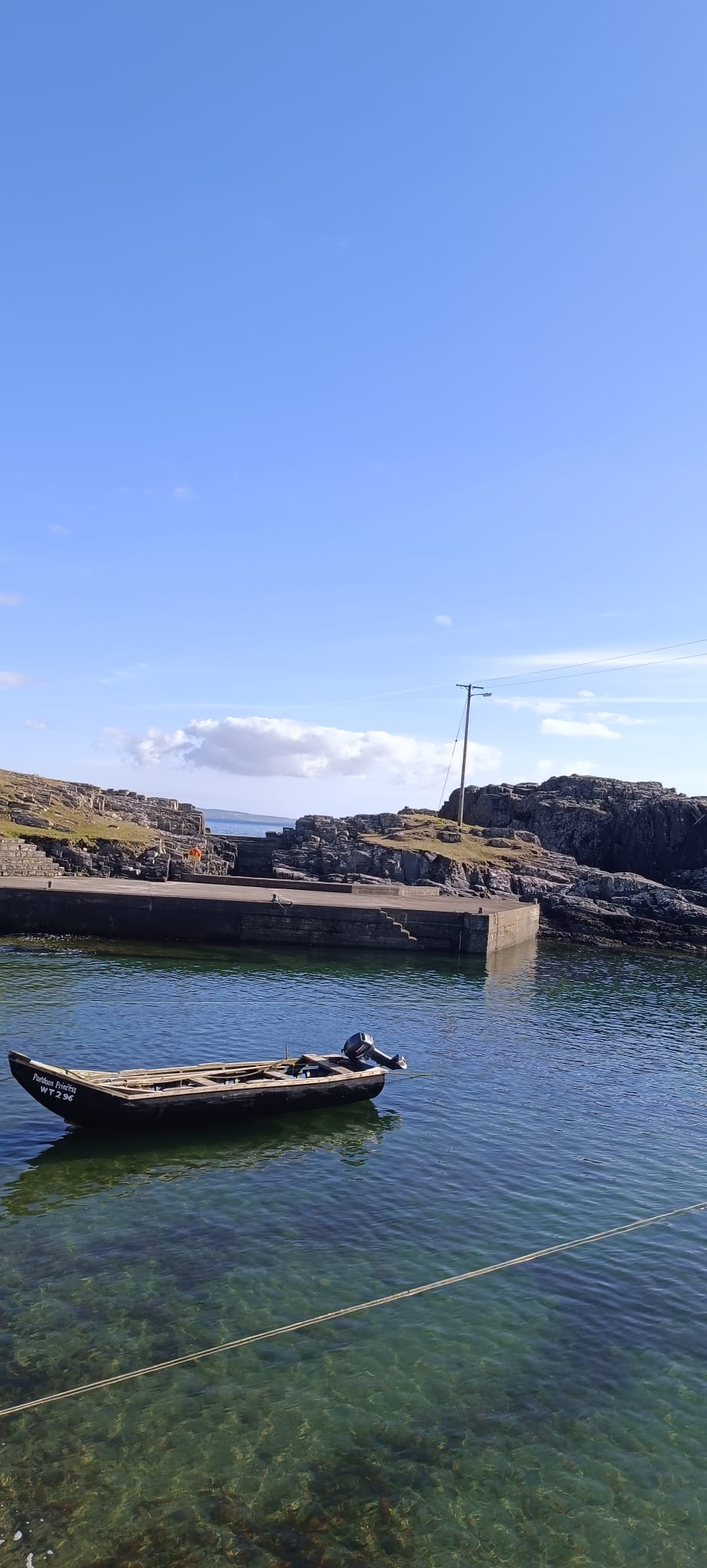 Wooden boat moored at the pier